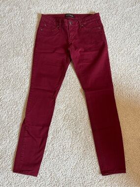 Express burgundy skinny jeans